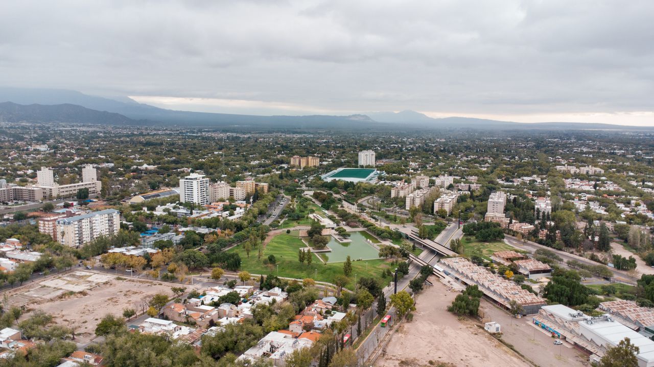 Explore the scenic aerial view of Mendoza, Argentina with sprawling cityscapes and lush greenery.