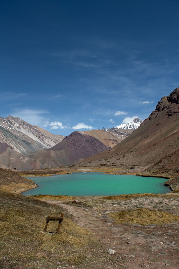 Services Captivating landscape of the vibrant lagoon surrounded by the Andes mountains in Mendoza, Argentina.